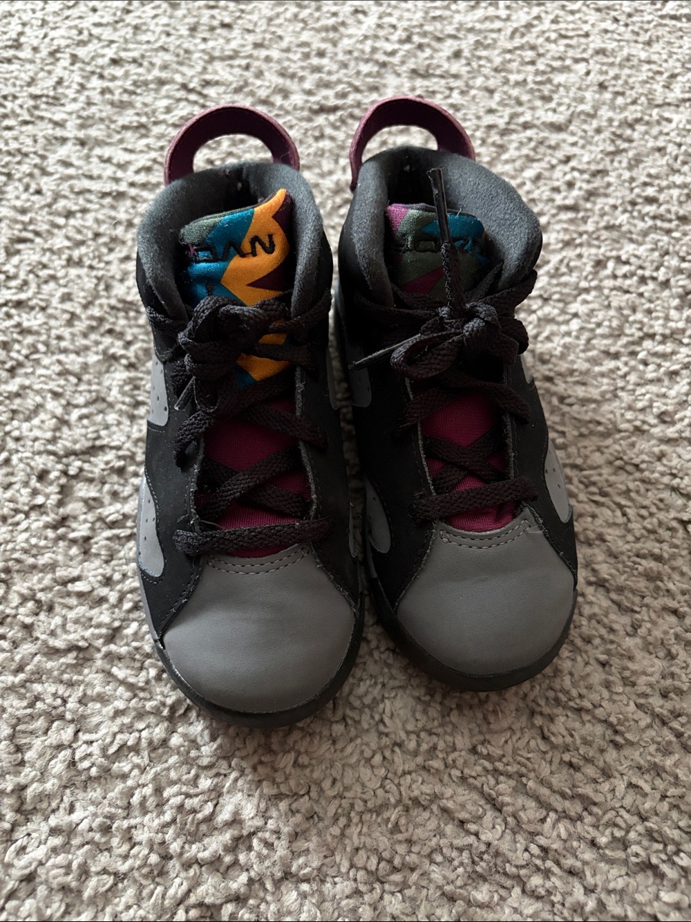 Nike Kids Black and Gray Sneakers with Pink and Teal Tongue Accents